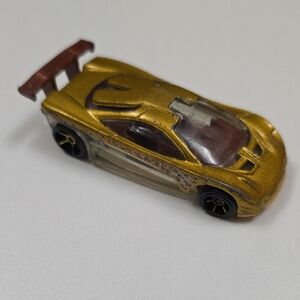 Hot Wheels HW Prototype 12 die-cast car - 
Gold - 1st Edition
